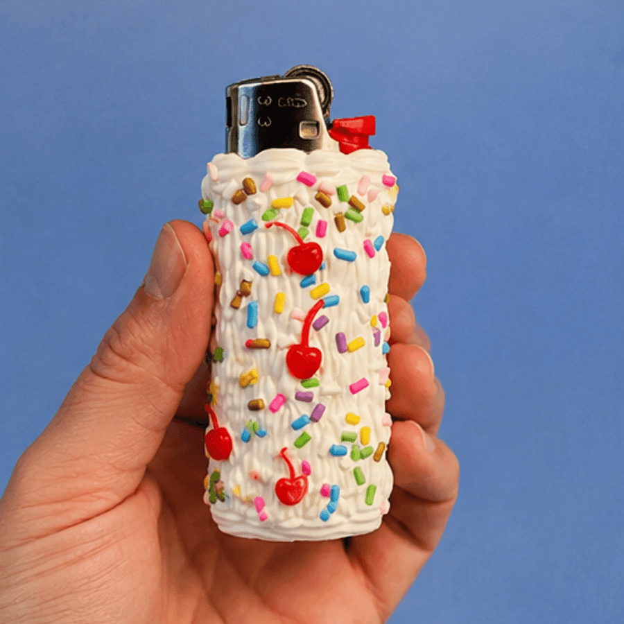 The Cake Lighter held in a hand for scale