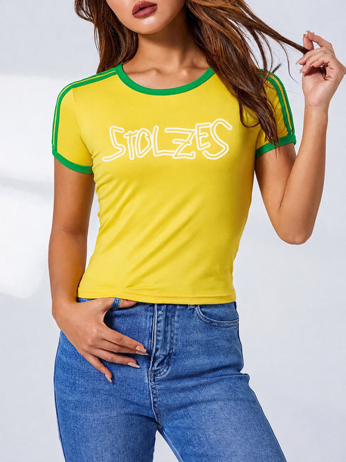 Yellow and green STOLZES baby tee with hand-drawn marker logo