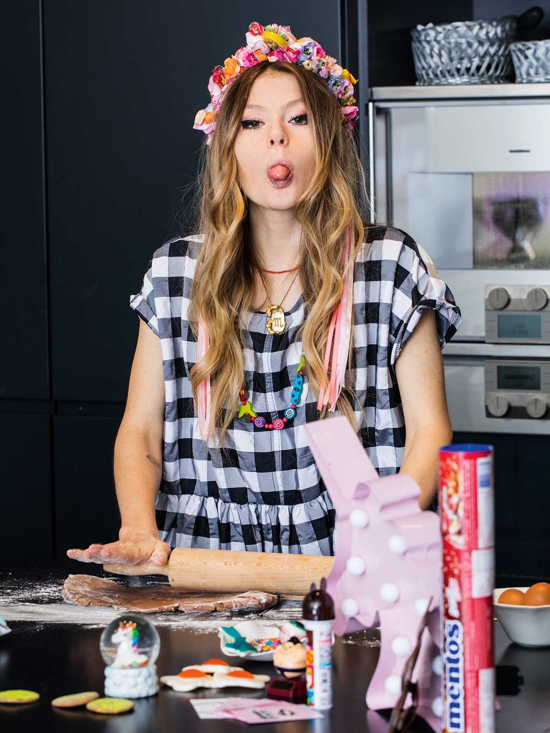 Sophia Stolz in her kitchen wearing a flower crown